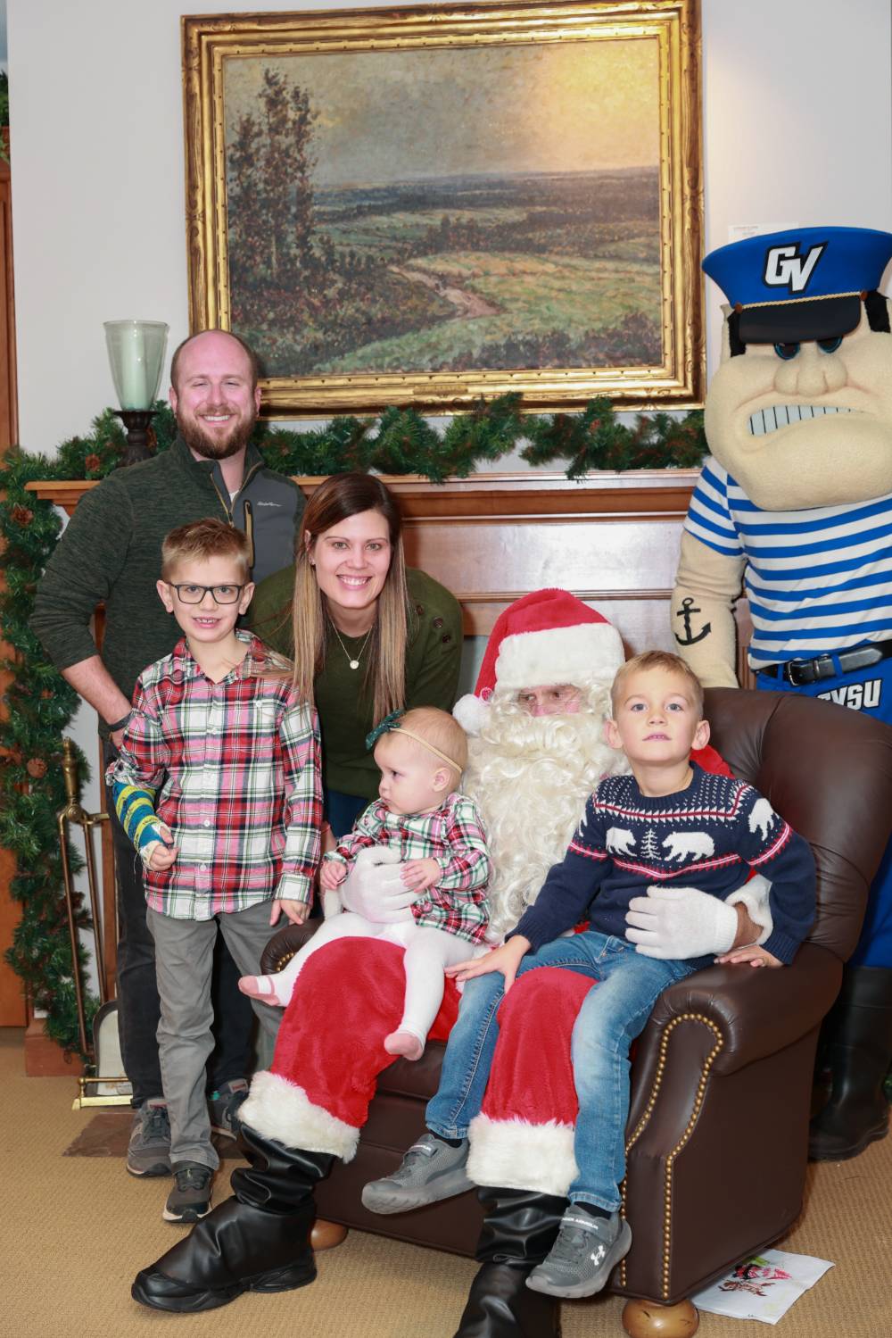 A family of five at the event with Santa & Louie.